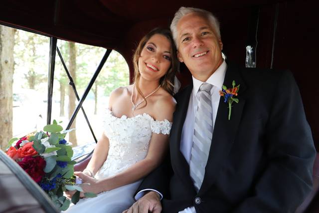 Father and bride in carriage