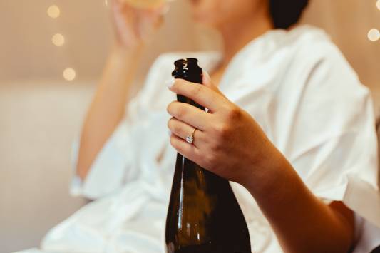 Bride hold champagne