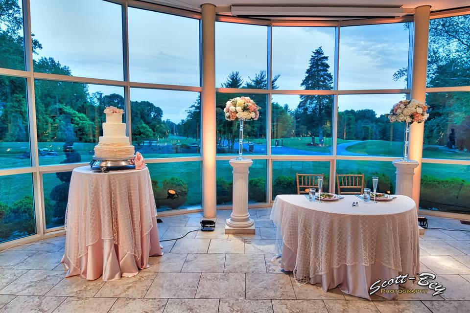 Sweetheart's table near the wedding cake