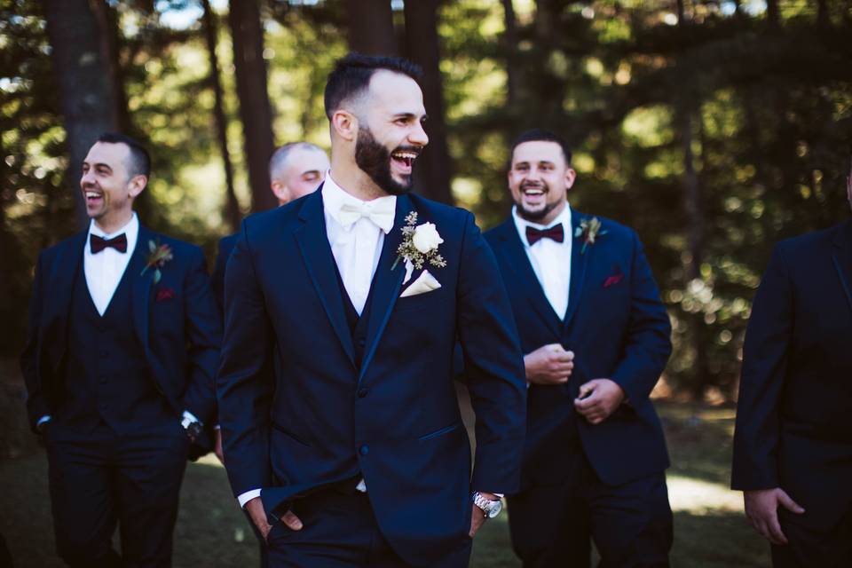 Laughing groom and groomsmen