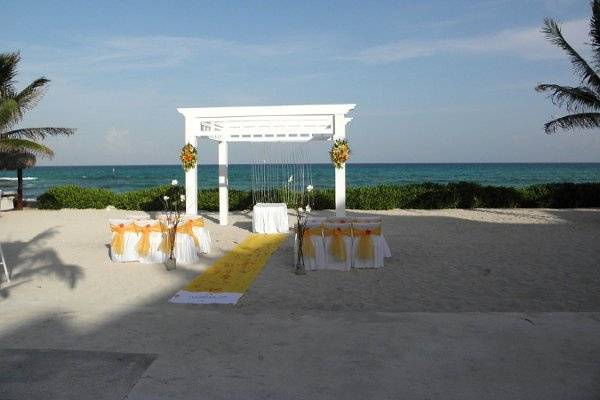 yellow wedding setup at El Dorado Royale in Riviera Maya, Mexico