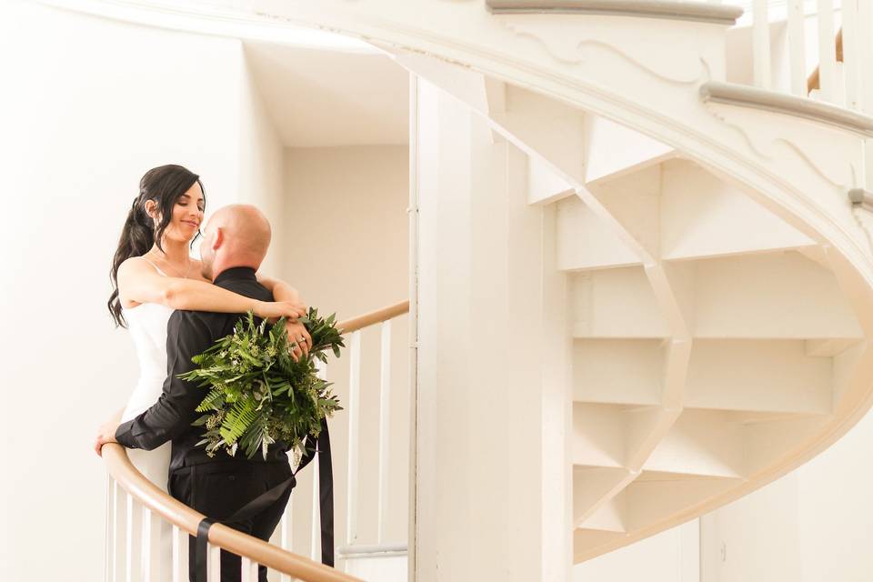 The newlyweds on the staircase