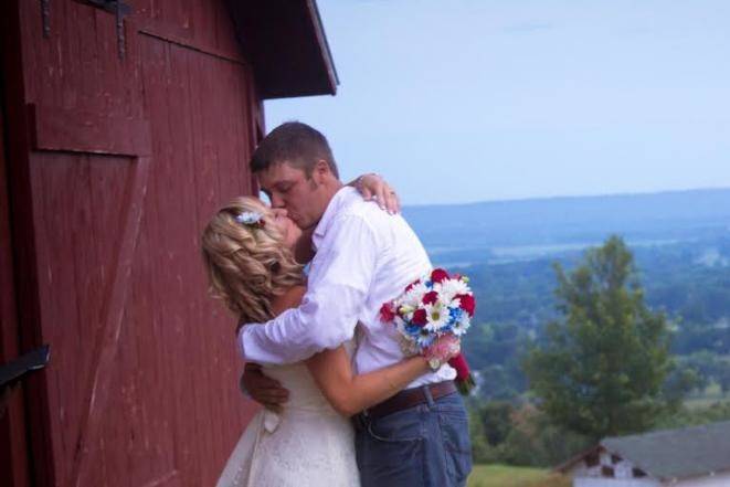 Kissing by the barn
