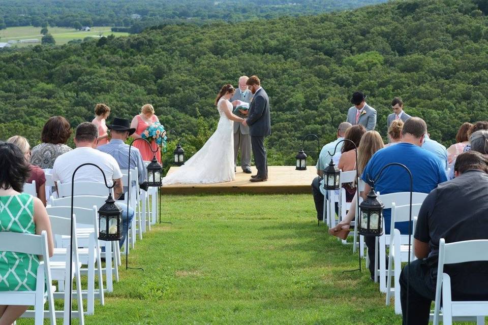 Newlyweds and their guests at sunset