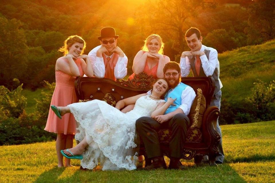 Newlyweds and their guests at sunset