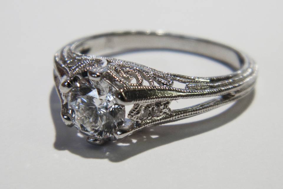 A gorgeous antique platinum ring with wonderful milgrain texture and filigree.