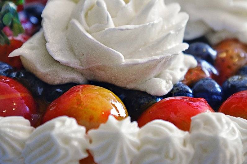 Close Up of Glazed Fruit atop a Cheesecake Wedding Cake