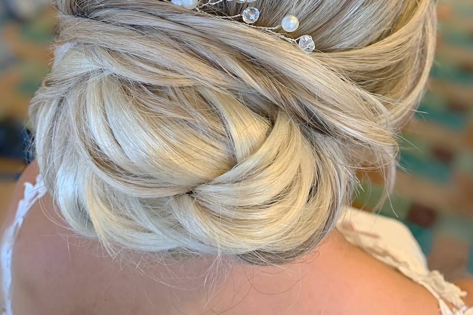 Low bridal bun, styled by Soph