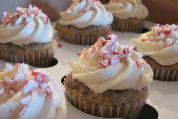 Mum's Christmas Parfait CupcakesInspired by the Icecream parfaits my grandmother would make us at Christmas time:Cookies and cream cupcakes, vanilla-peppermint cream filling, vanilla frosting, and topped with peppermint dust.