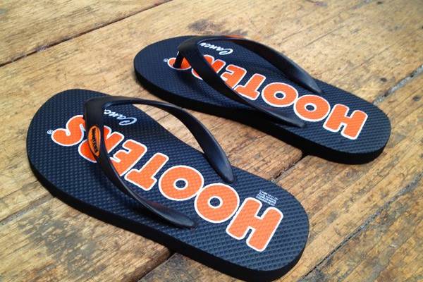 Hooters Cancun Flip Flops, Corporate event flip flops, convention , fundraisers, and any type of event , custom mark on the sand ,sand imprint flip flops from partyflops, we are the fastest response company in the world who manufactures and design your flip flops,