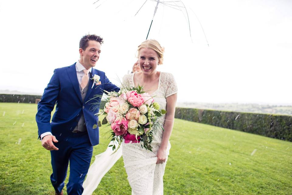 Smiling bride on a rainy day