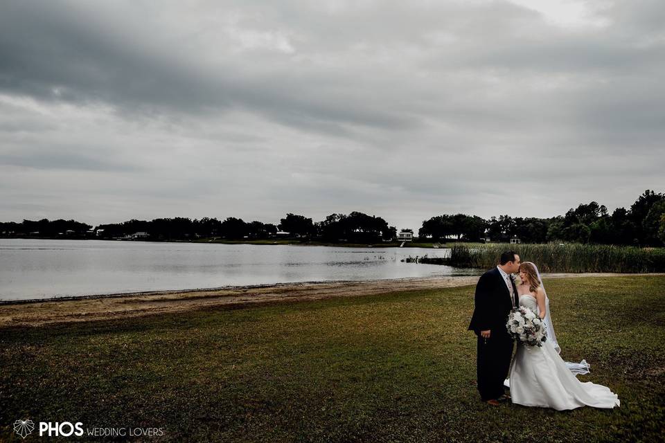 Newlyweds by the vast lake