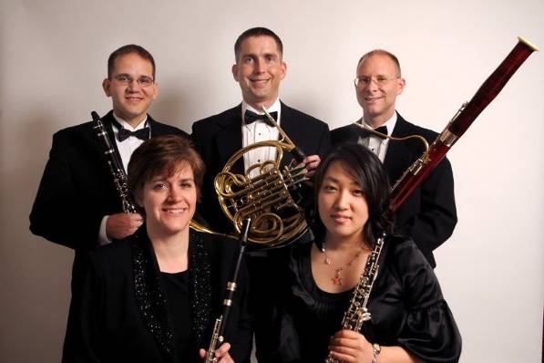 Top row (from left): Martin Gold - Clarinetist/Arranger, Benjamin Cadle - French Hornist, Max Wharton - Bassoonist.  Bottom row (from left): Barbara Vigil - Flutist, Janice Shin - Oboist