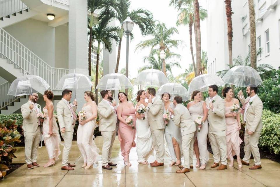 Wedding party under an umbrella