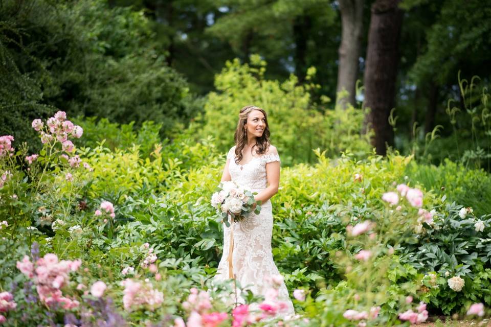 Beautiful bride surrounded by lush flora