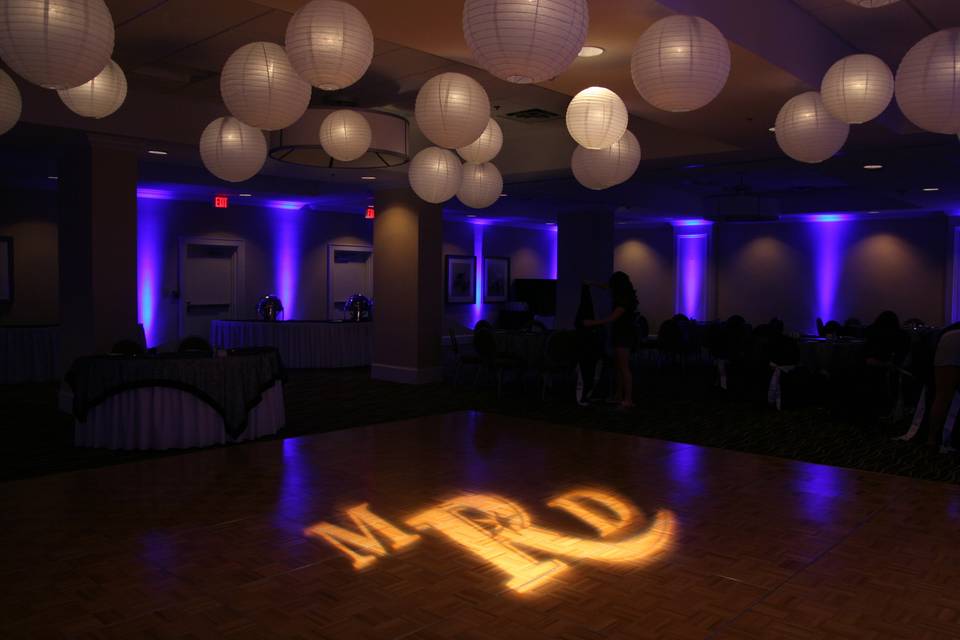 Purple uplights and monogram projection