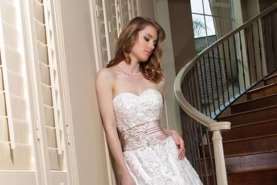 DaVinci Bridal Style #: 50134
Lace appliqué covers this A-line gown and features a sweetheart strapless neckline.  Ruched satin trim accents the waistline with a lace appliqué detail.  Zipper back.