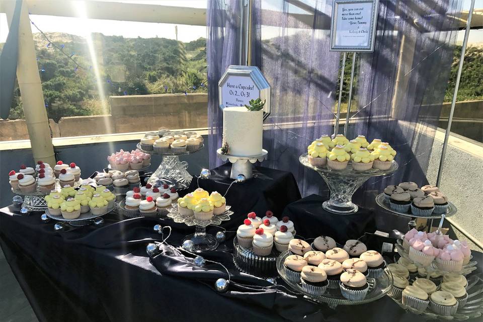 Wedding cake table and flowers by the beach