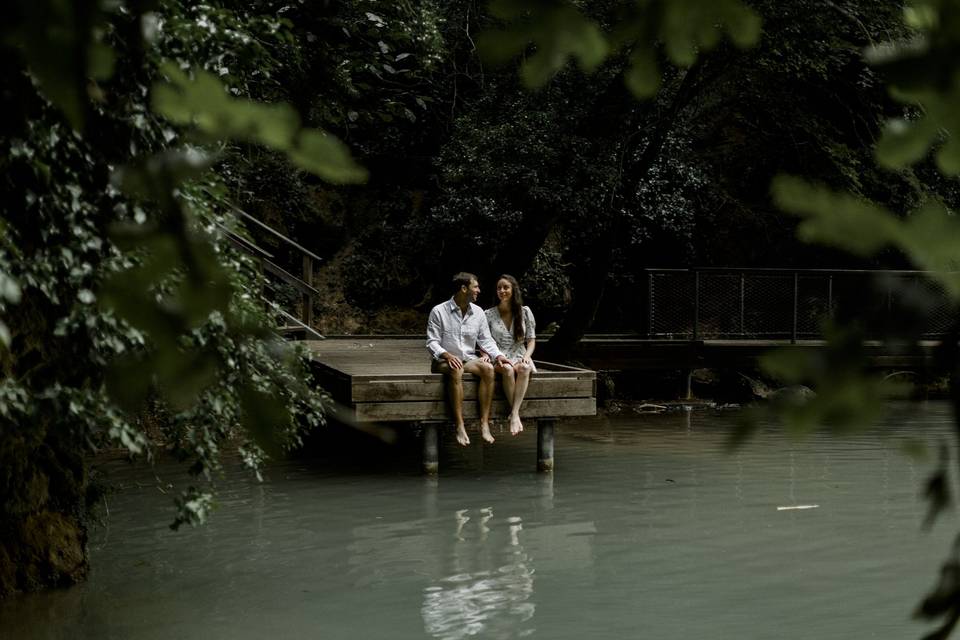 Couple sitting by the water's edge