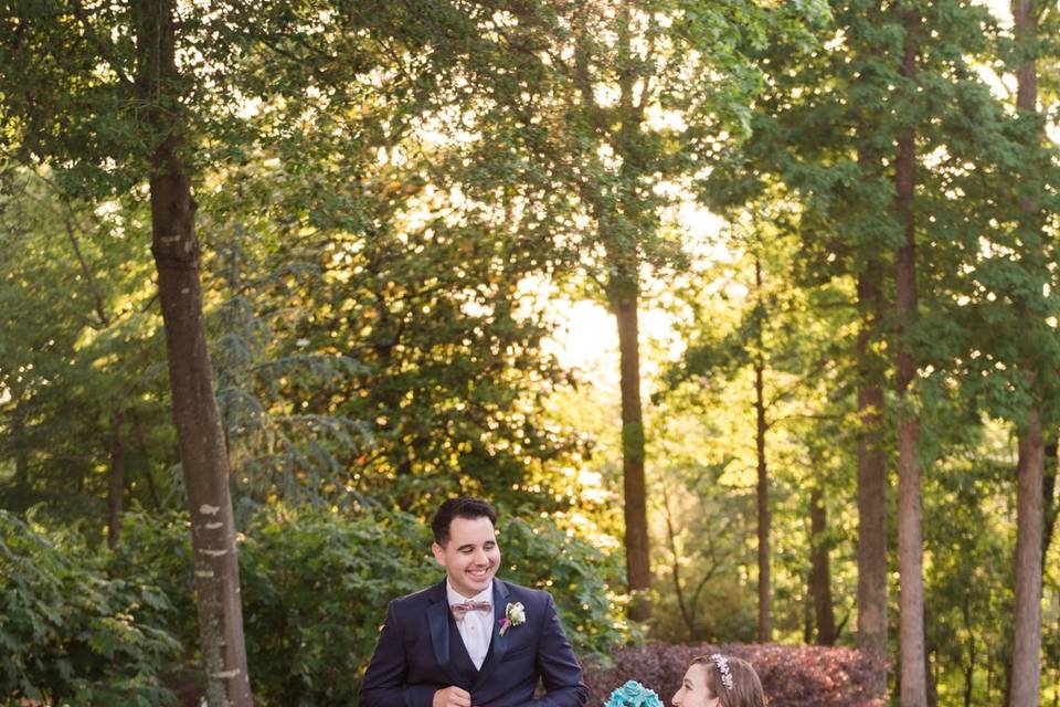 We love this candid photo capturing a sweet moment between these two and our famous teal blue chairs. By Meredith Ryncarz Photography