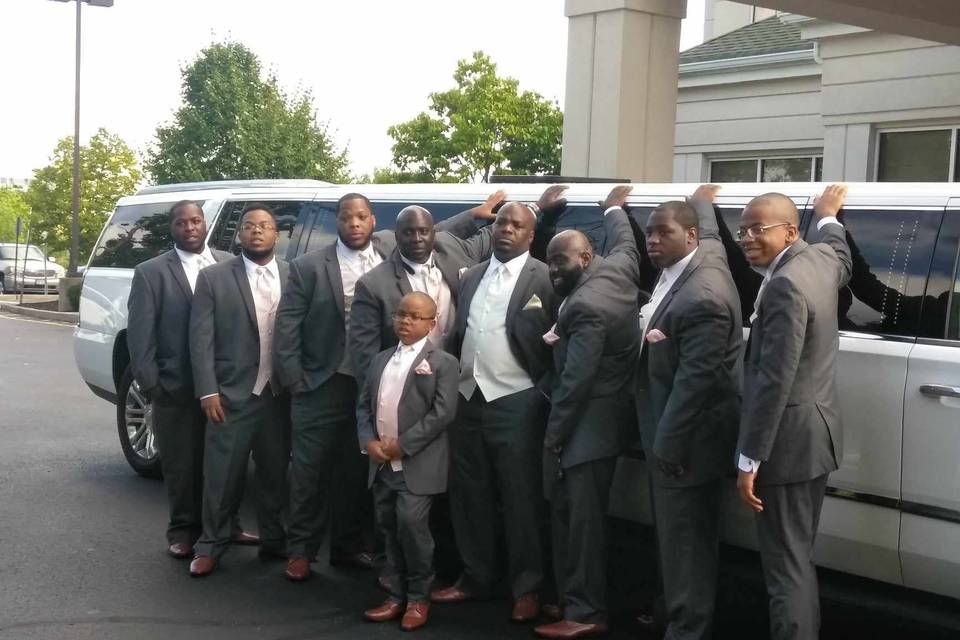 The gentleman looking dapper in front of our 12-passenger Cadillac Esacalade