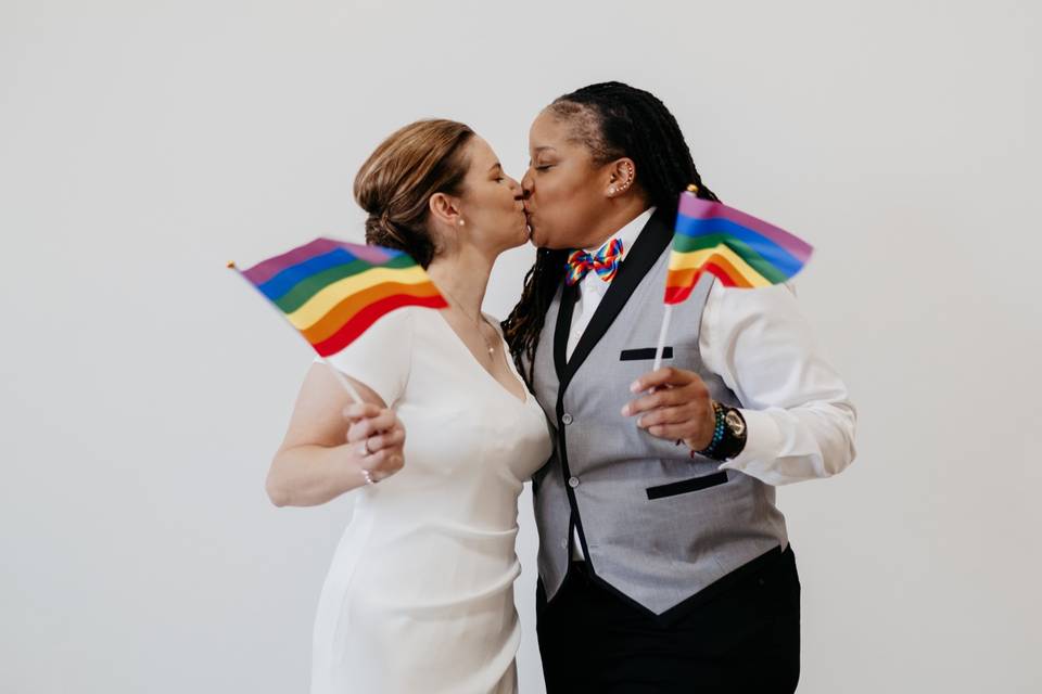 Rainbow flag wedding kiss