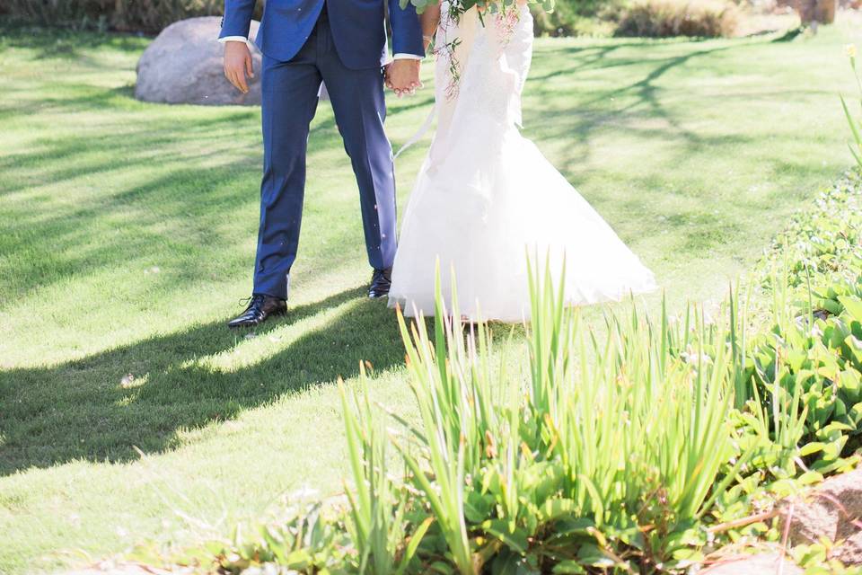 Couple leisurely walk hand in hand​