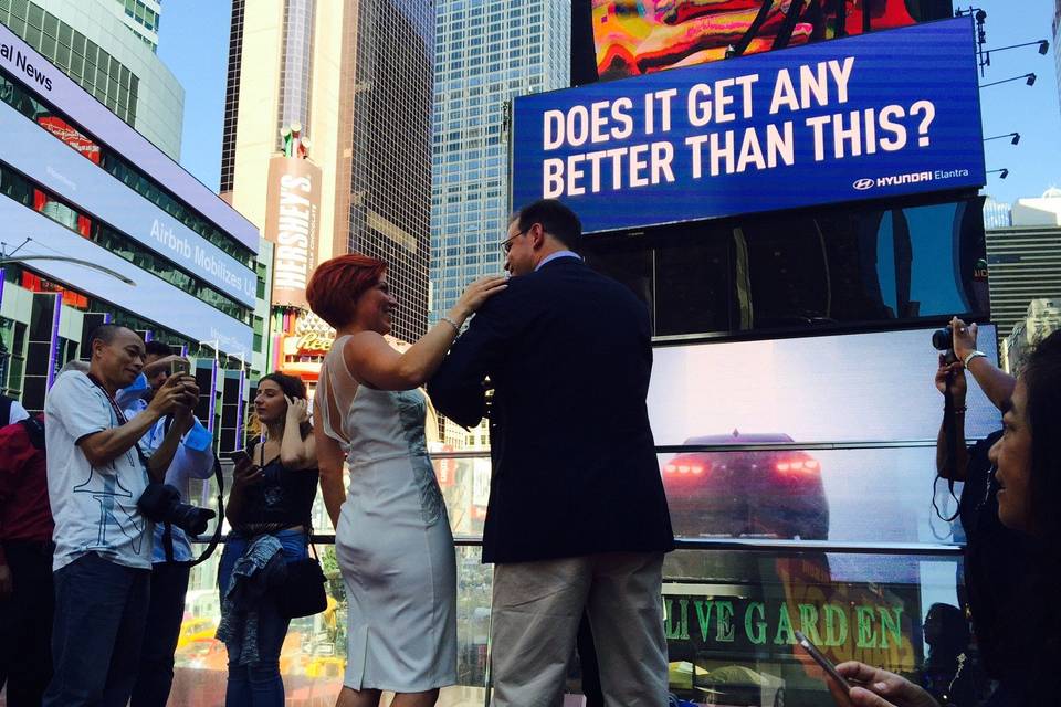 Couple by a sign