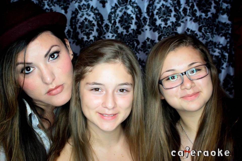 Taking a picture with the birthday girl and her sister in our photo booth!