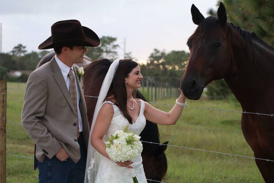 Bride petting the horse
