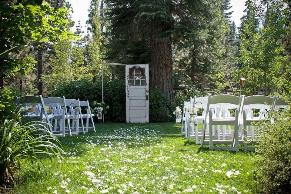 The main aisle way for the bride. (ceremony site)
Location: Backyard wedding in South Lake Tahoe, CA
Theme: Rustic
Colors: Green, White, Gray
Number of Guests: 100
Type of Coordinating: Full service with set up (reception and ceremony same location)