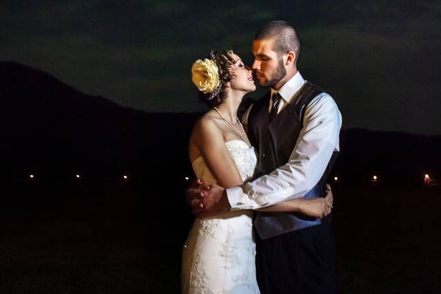 Lauren & Wes embracing under the moonlight after their wedding