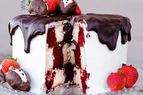 Cake with chocolate drips and berries
