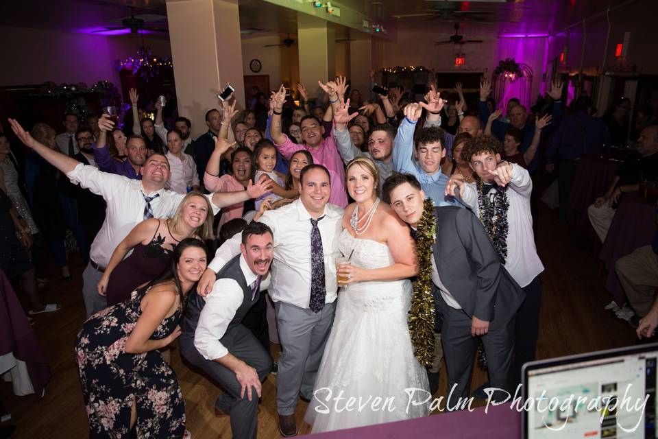 Packed dance floor with the newlyweds