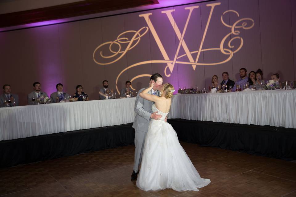 Ending their first dance with a kiss