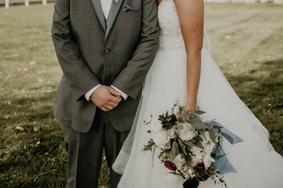 A happy couple in front of the barn