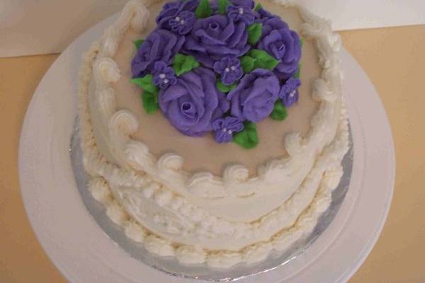 5th Anniversary cake made in the likeness of the original wedding cake.
Buttercream Cake w/ buttercream roses and violets