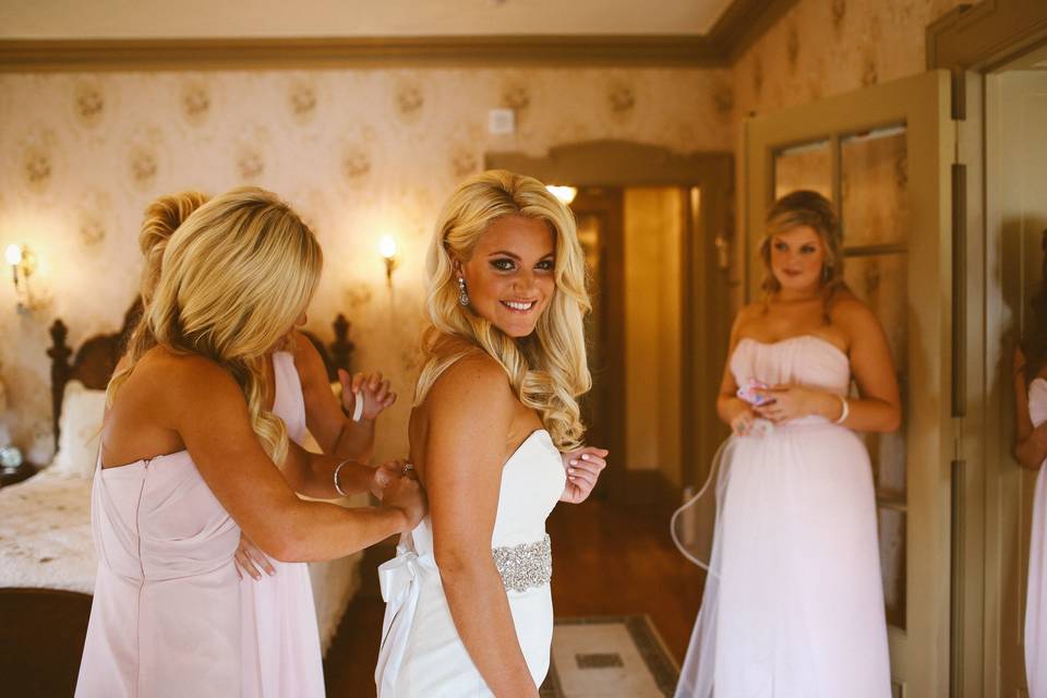 Bride getting in her gown