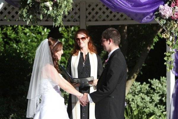 Look at the beautiful bride and groom.  Can you see the microphone?