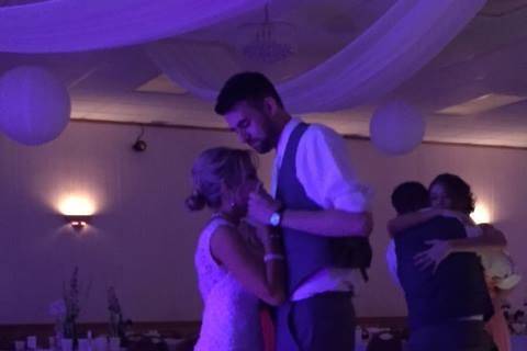 Dancing couple and guests