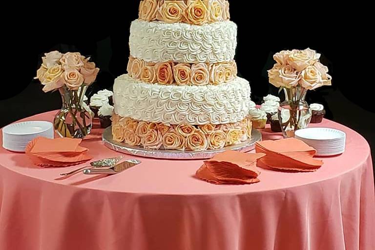 Tiered cake floating on roses