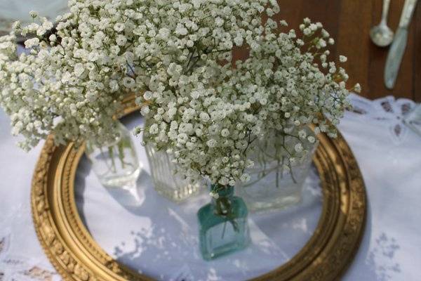 antique bottles and frame centerpieces