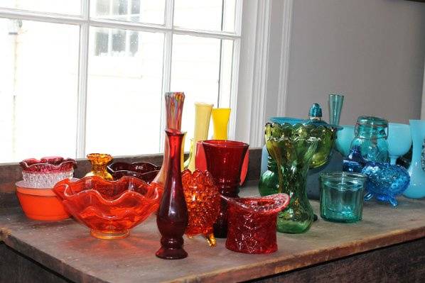 a rainbow of colored glassware