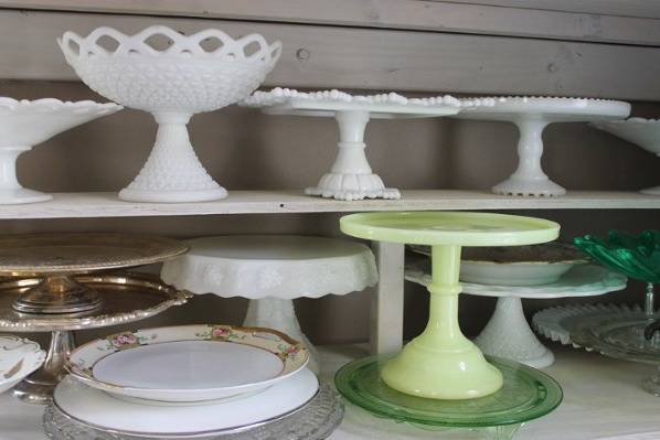 lots and lots of cake stands for dessert tables