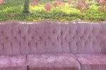 Pink velvet sofa great for wedding reception sitting area or pictures with wedding party