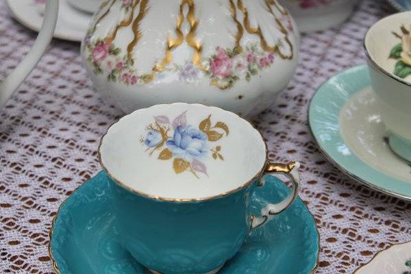 gorgeous teacups and teapots can be used for traditional use or to decorate in the centerpieces