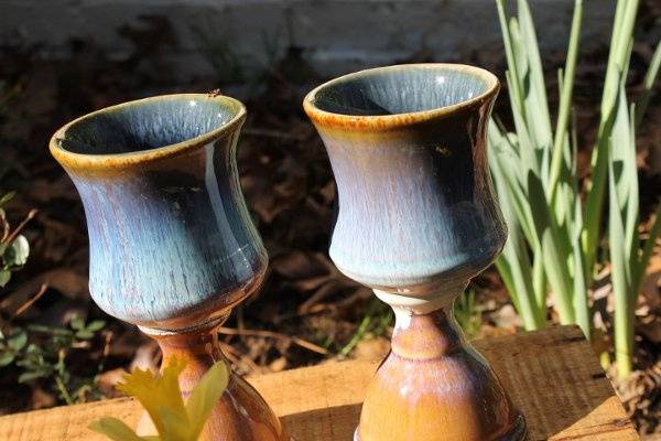 Lovely pottery pieces for a rustic wedding, these blue ceramic goblets are perfect for the bride and groom