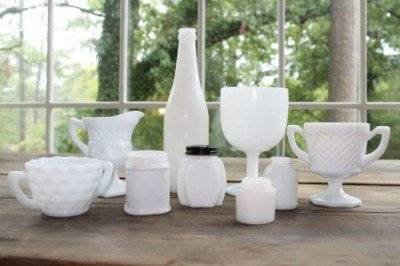 unique milk glass of different sizes and shapes, perfect for a wedding reception