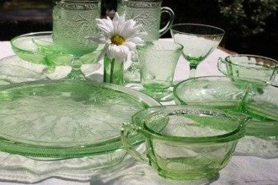 green depression glass adds a touch of lovely color to each table