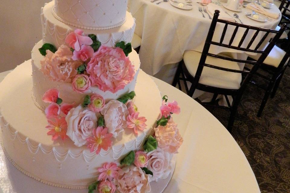 Pink sugar flower wedding cake
